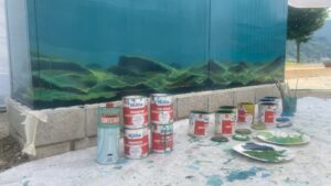 Murale 360 gradi su un quadro elettrico a Caslano di un acquario con Luccio Carpa e altri pesci